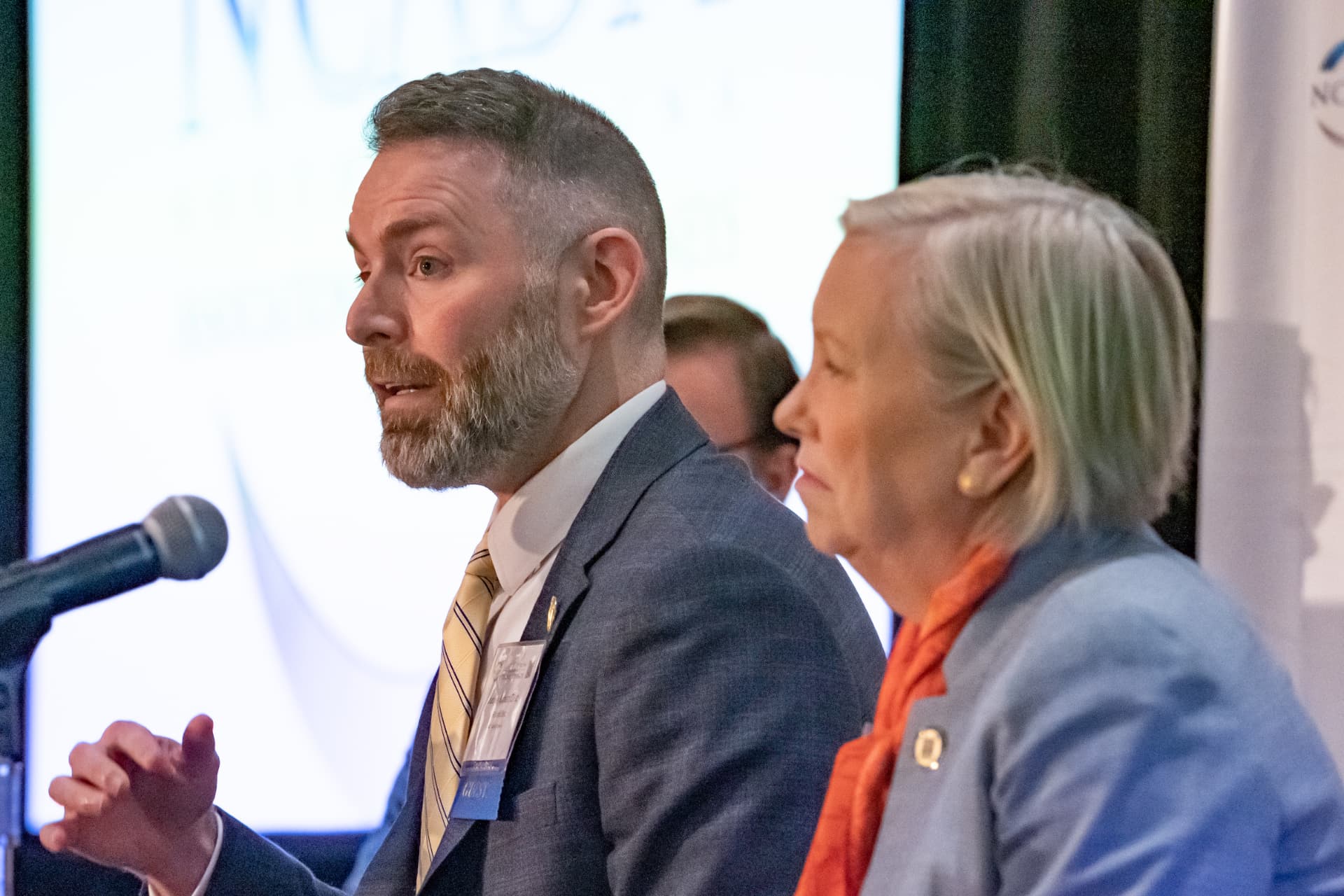Business professionals talking at a corporate event